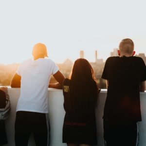 four person looking at the city