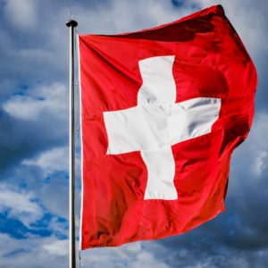 a red and white flag with a white cross on it