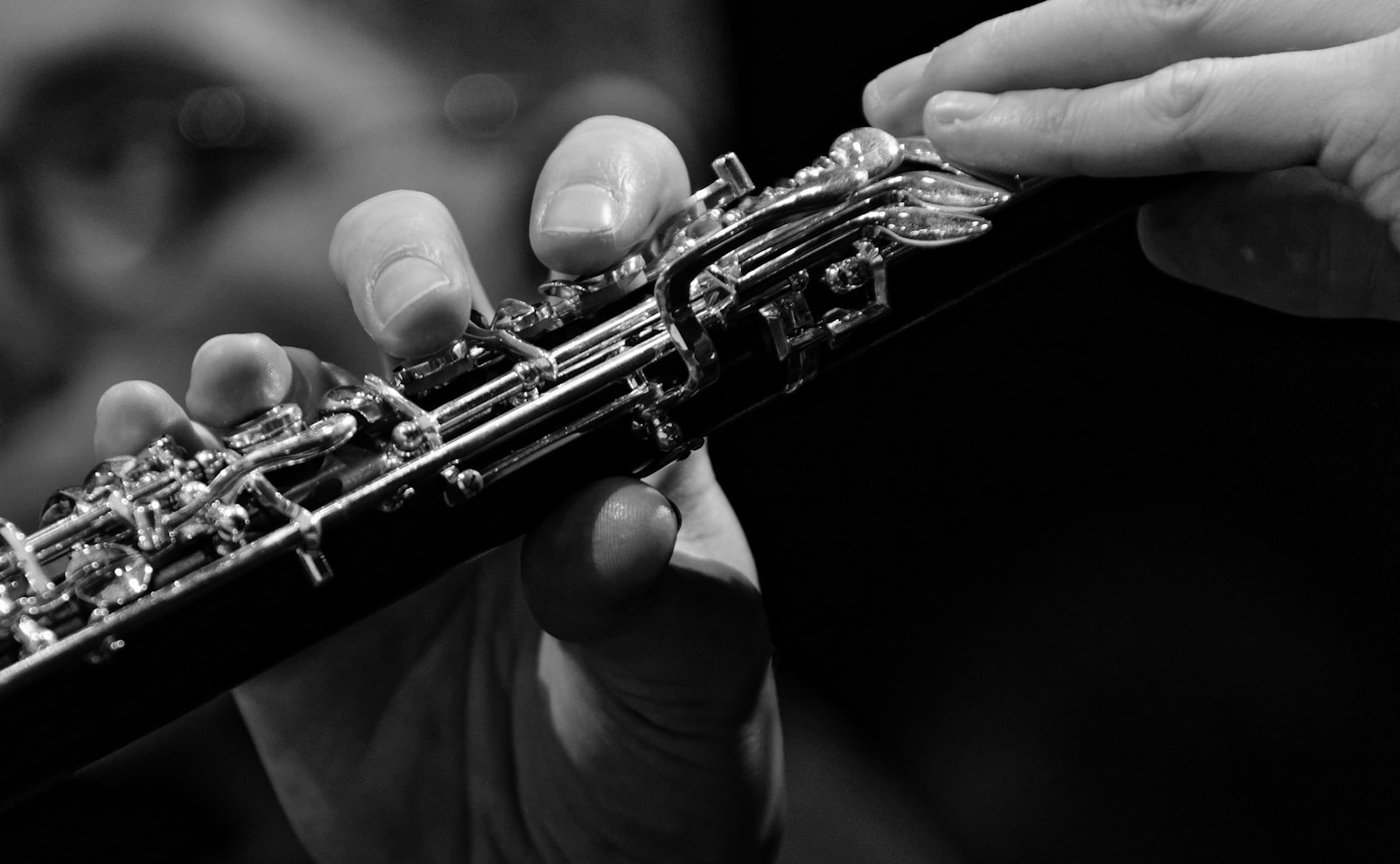 a close up of a person playing a flute